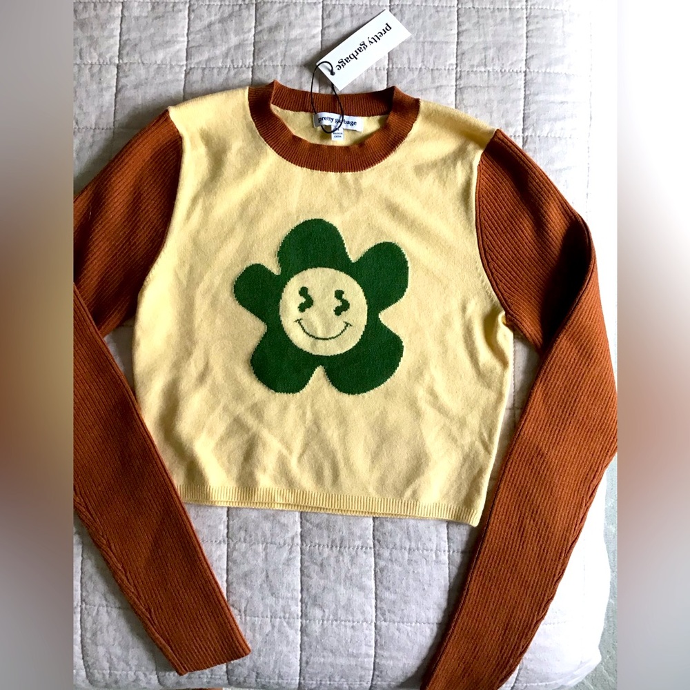Cropped sweater with cute floral design. size medium juniors.